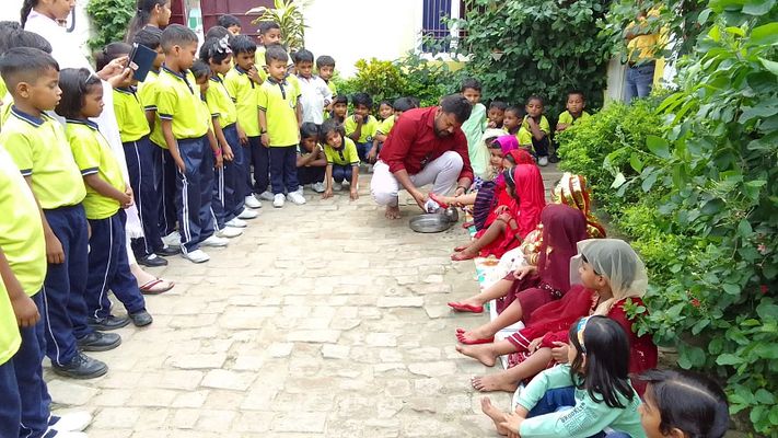 Teacher and students building community spirit